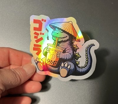 Godzilla drinking a boba tea 3 Inch Waterproof Vinyl Holographic Sticker-image