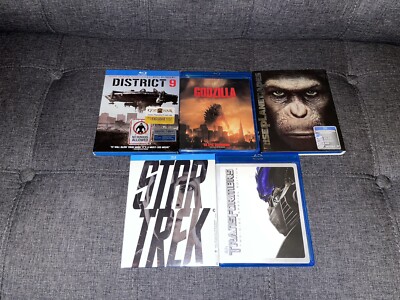 Blu Ray Movies District 9, Godzilla, Rise of The Apes, Star Trek, Transformers-image