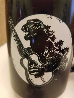 Godzilla Coffee Mug with a GUITAR. NEW, never used, no chips. Great present!-image